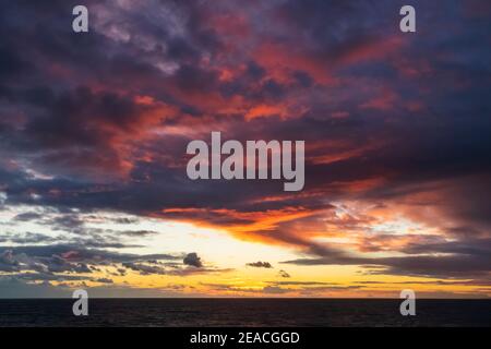 England, East Sussex, Eastbourne, Birling Gap, Sunset over The English Channel Stock Photo