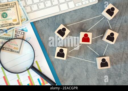 Organization structure, team building, recruitment, management and human resources concepts. Person icons on wooden cubes linked to each other. Stock Photo