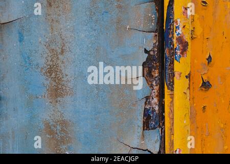 Blue and yellow metal background,Rusty metal background with streaks of rust,abstract art. Stock Photo