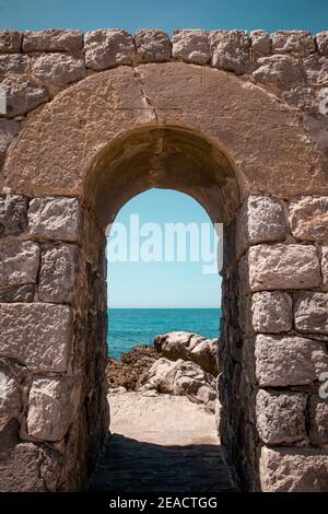 Stones, shore, sea, Cefalu, Sicily, Italy Stock Photo