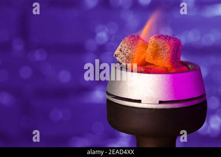 Burning hookah coals in hookah bowl close up Stock Photo