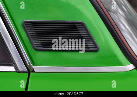 Ventilation grill on the body of the car, Side view. The body is green. Kurskoe, Crimea - 4 October, 2020 Stock Photo