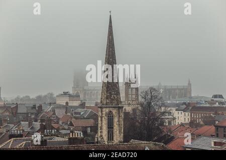 View of York Minster and City of York from the top of Clifford's Tower during a cold and foggy day in Winter, Yorkshire, England, UK. Stock Photo