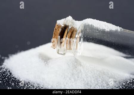 Makrogol powder photographed against a black background in the studio Stock Photo
