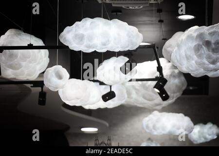 Modern CCTV on the ceiling of urban shopping center. Security camera in the shopping mall. Stock Photo