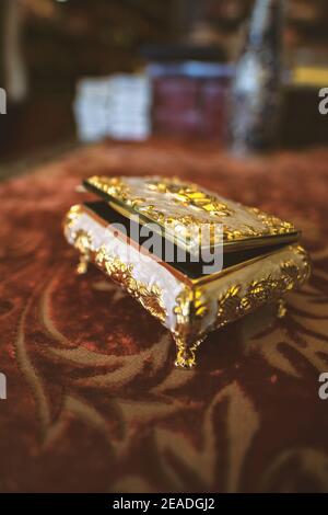 Selective focus, Of a small golden jewelry box Stock Photo