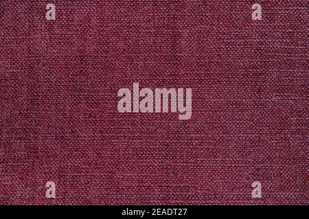 Wooly tapestry in solid garnet color, homely background with copy space, concept for home improvements, ideas for soft furnishings Stock Photo