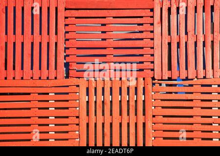 Abstract background of old wooden pallets made into an orange fence, stock photo image Stock Photo