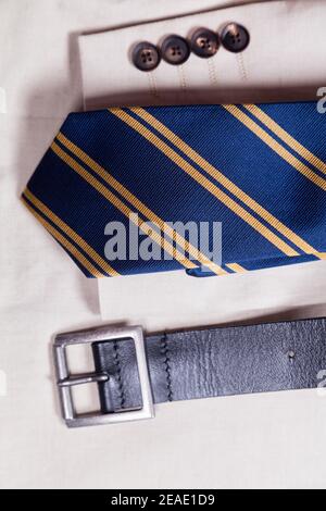 Close-up of men's cream jacket with a tie and belt. Stock Photo