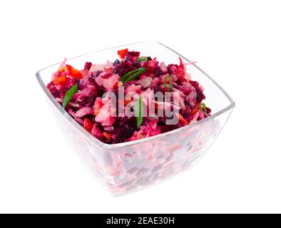 Diet vegetarian vegetable salad with beets in glass salad bowl on white background. Studio Photo Stock Photo