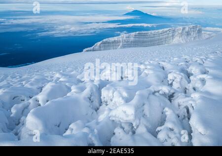 Magic breathtaking view to Snows of Kilimanjaro volcano and glaciers with Mount Meru 4562m silhouette. 5895m - the highest point of Africa and the hig Stock Photo