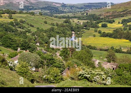 Panoramic view of Swaledale, over the village of Low Row, Yorkshire Dales National Park with hay meadows in full flower Stock Photo