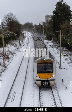 Southend on Sea, Essex, UK. 9th Feb, 2021. Storm Darcy has dropped further snow, and brought icy and windy conditions. C2C train heading towards London, approaching Westcliff on Sea station Stock Photo