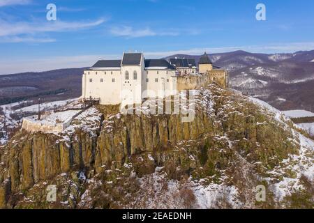 Füzér, Hungary - Aerial view of the famous castle of Fuzer built on a volcanic hill named Nagy-Milic. Zemplen mountains at the background. Stock Photo