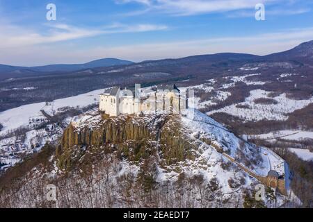 Füzér, Hungary - Aerial view of the famous castle of Fuzer built on a volcanic hill named Nagy-Milic. Zemplen mountains at the background. Stock Photo