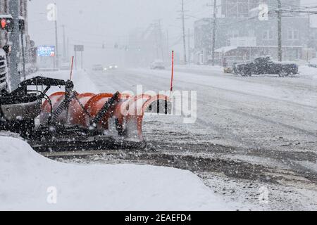 NORWALK, CT, USA -FEBRUARY 7, 2021:  Snow plow truck  during snow storm day on Connecticut Ave. and North Taylor Avenue Stock Photo