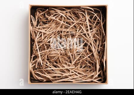 Opened Gift Box With Decorative Straw Filler Shavings Stock Photo