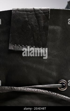 Black leather empty label on textile surface close up view Stock Photo