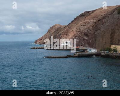 view of coastal cliffs and marina at village Puerto de Sardina del Norte at Grand Canaria, Canary islands, Spain Stock Photo