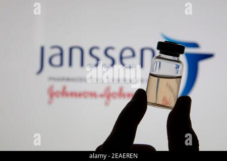 OXFORD, UK - February 2020: A covid vaccine vial against the Janssen logo Stock Photo