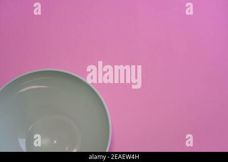 white bowl with pink background viewed from above Stock Photo