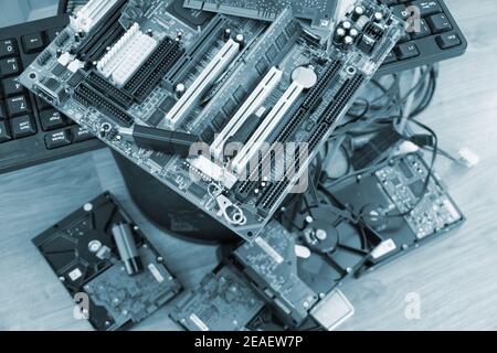 Electronic trash, motherboards, disks and other computer components. Stock Photo