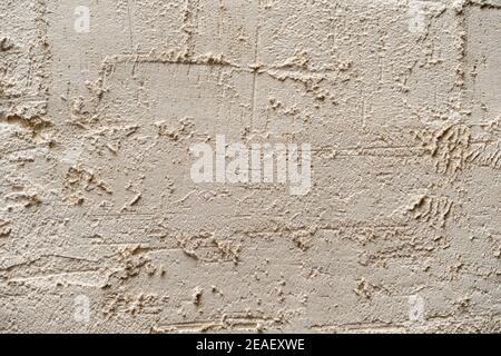 white textured plaster on the wall. Background for texture and design Stock Photo