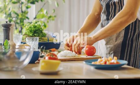 Close Up Shot of a Man Preparing a Healthy Vegetarian Organic Salad Meal in a Modern Kitchen. Natural Clean Diet and Healthy Way of Life Concept.