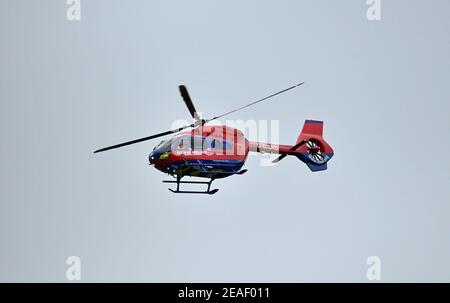 Devon Air Ambulance helicopter in flight. Stock Photo