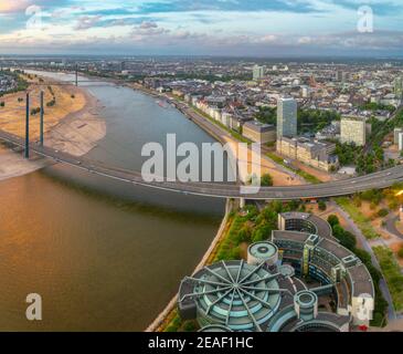 Sunset aerial view of Dusseldorf with Rheinkniebrucke bridge in Germany. Stock Photo