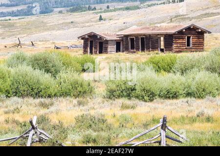 An abandoned homestead sits on the shores of the Green River in Western Wyoming. Stock Photo