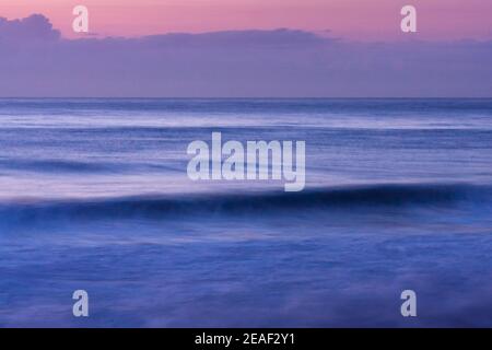 Gentle waves of the Indian Ocean at dawn, Ballito Bay, Ballito, KwaZulu-Natal, South Africa Stock Photo