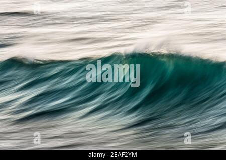 Small wave breaking at dawn, Ballito Bay, Ballito, KwaZulu-Natal, South Africa Stock Photo