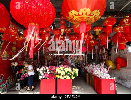 Kuala Lumpur, Malaysia. 9th Feb, 2021. A shopper selecting Lunar New Year decorations in China Town.Chinese around the world will be celebrating the Chinese Lunar New Year and welcome the year of Ox which falls on the 12th of February. Credit: Wong Fok Loy/SOPA Images/ZUMA Wire/Alamy Live News Stock Photo