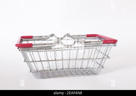 Empty small pink shopping cart isolated on white background. Shopping concept. Stock Photo
