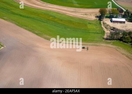 Farmers plant and spray on their fields in rural Wisconsin. Stock Photo