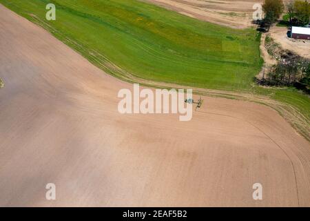 Farmers plant and spray on their fields in rural Wisconsin. Stock Photo