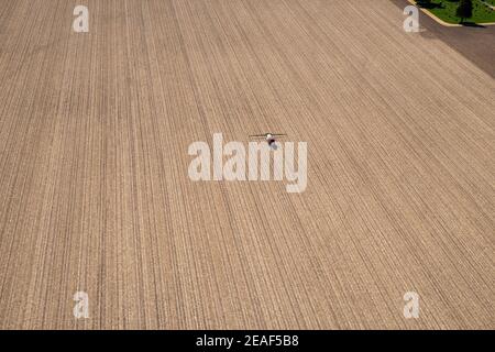 Farmers plant and spray on their fields in rural Wisconsin. Stock Photo