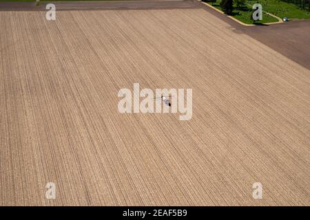 Farmers plant and spray on their fields in rural Wisconsin. Stock Photo