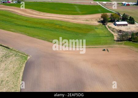 Farmers plant and spray on their fields in rural Wisconsin. Stock Photo