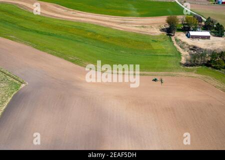 Farmers plant and spray on their fields in rural Wisconsin. Stock Photo