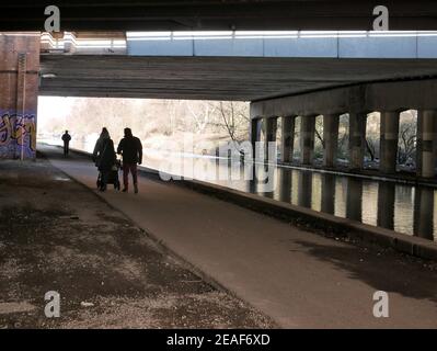 Stretford, Manchester, UK. 9 February 2021. Path used by walkers, runners and cyclists near the Bridgewater Canal. Credit: Julian Brown Stock Photo