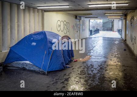 A rough sleeper’s tent and personal belongings seen during the day near Waterloo on one of the coldest days of 2021. London, UK. Stock Photo