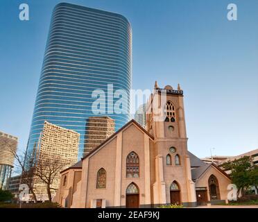 Antioch Missionary Baptist Church, 1400 Smith Street Tower (former Enron Center) behind, reflecting other downtown skyscrapers, Houston, Texas, USA Stock Photo