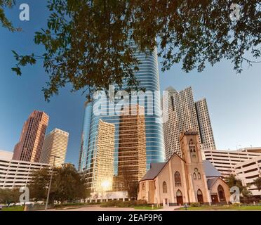 Antioch Missionary Baptist Church, 1400 Smith Street Tower (former Enron Center) behind, reflecting other downtown skyscrapers, Houston, Texas, USA Stock Photo