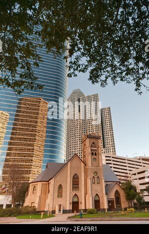 Antioch Missionary Baptist Church, 1400 Smith Street Tower (former Enron Center) behind, reflecting other downtown skyscrapers, Houston, Texas, USA Stock Photo