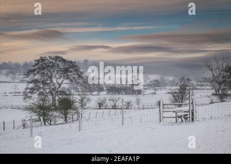 Stile in wintery conditions, Clitheroe, Ribble Valley, Lancashire, UK. Stock Photo