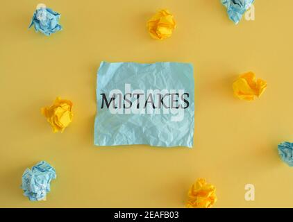 Mistakes word written on colorful notes.Conceptual photo Something not correct Lack of accuracy Wrong Incorrect Fail. Colored crumpled reminder paper, Stock Photo