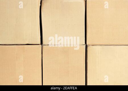 Square cardboard boxes in two rows in full screen. Front view with copy space. Mockup Stock Photo