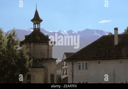 Nice view from the old tower and the peaks of the Carpathian mountains in the old town of Sinaia, in Romania. Stock Photo